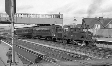 Photo of A1X 0-6-0 tanks 32650 and 32640 arriving at Havant with the empty coaching stock train from Fratton, September 9th 1962