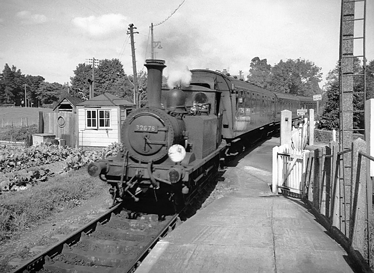 Photo of A1X 0-6-0 tank loco 32678  at Langstone Station on a Havant to Hayling Island train on 9th September 1962 