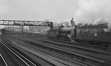 Possibly the last time a Lord Nelson and a King Arthur class met each other whilst hauling trains on the old LSWR. 30770 hauls an ecs train down beyond Vauxhall, meeting a Lord Nelson on an up Ocean Liner Boat train. Photographed from a 4-Sub unit heading between Vauxhall and Clapham Junction. 9th September 1962
