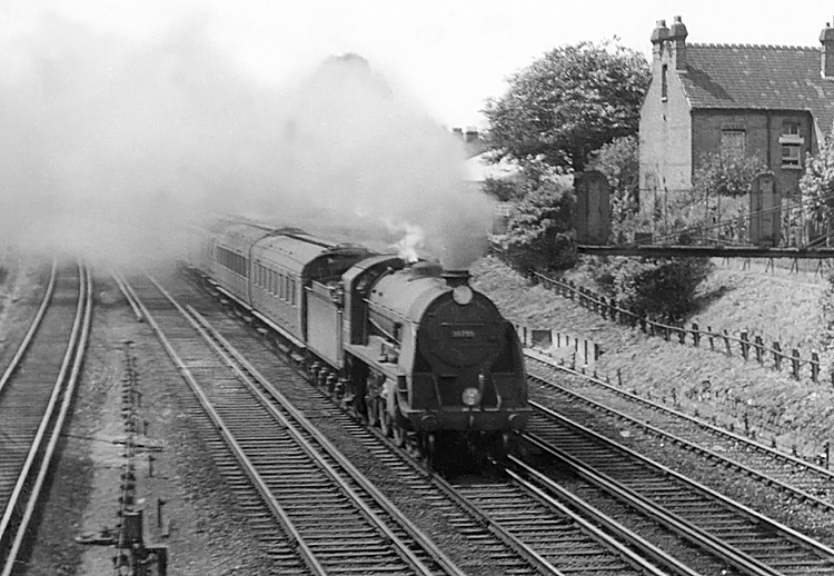 Photo of King Arthur Class 4-6-0 30795 on an up Salisbury train passing New Malden in 1962