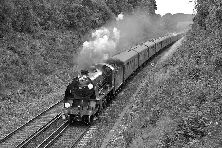 Photo of King Arthur Class 4-6-0 30777 on a London to Weymouth special train between Roundwood Summit and Micheldever on 18th August 2010