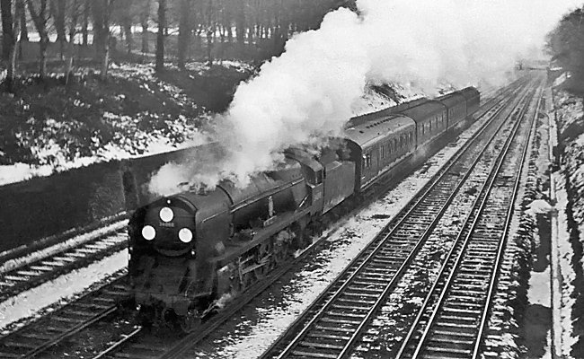 Photo of Bulleid Battle of Britain Class pacific number 34088, 213 Squadron, between South and East Croydon with a Brighton to London train, most likely the 07.35 ex Brighton, (via Oxted at 09.11), probably in winter 1961/62