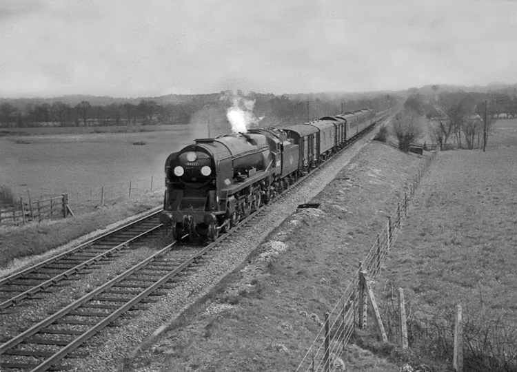 Photo of Bulleid West Country Class pacific number 34027, Taw Valley, near Edenbridge with the 13.55 Brighton to London train on 19th April 1962