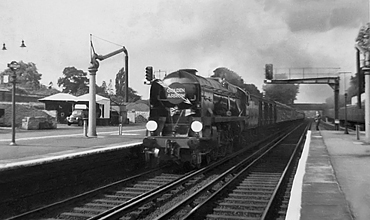 Photo of Bulleid Battle of Britain Class pacific number 34088, 213 Squadron, heading the down Golden Arrow pullman train through Bickley on 18th September 1960