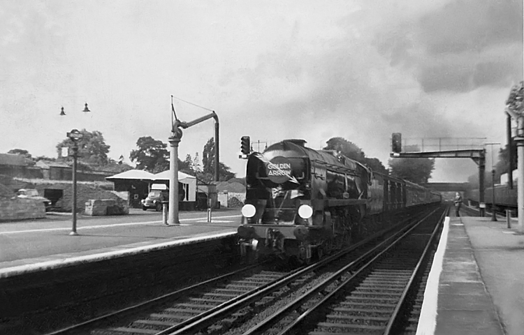 Photo of Bulleid Battle of Britain Class pacific number 34088, 213 Squadron, heading the down Golden Arrow pullman train through Bickley on 18th September 1960