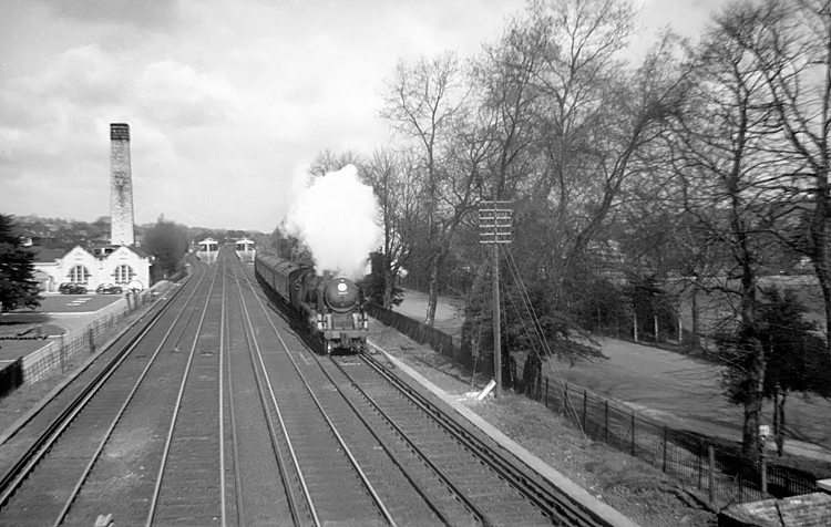 Photo of Bulleid Battle of Britain Class pacific number 34077, 603 Squadron, heading a Victoria to Dover or Folkestone  boat train through Shortlands, near Bromley South, in the first half of 1961
