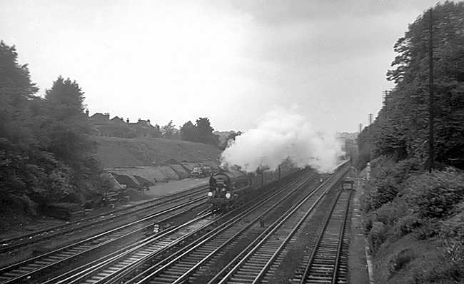 Photo of Bulleid West Country Class pacific number 34100, Appledore, heading the last steam locomotive hauled down Golden Arrow pullman train through Bromley South on 11th June 1961