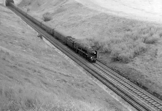 Photo of a Bulleid West Country Class pacific leaving  Bincombe Tunnel at the  top of Upwey bank with  a train from London, Waterloo to Weymouth in the mid 1960s