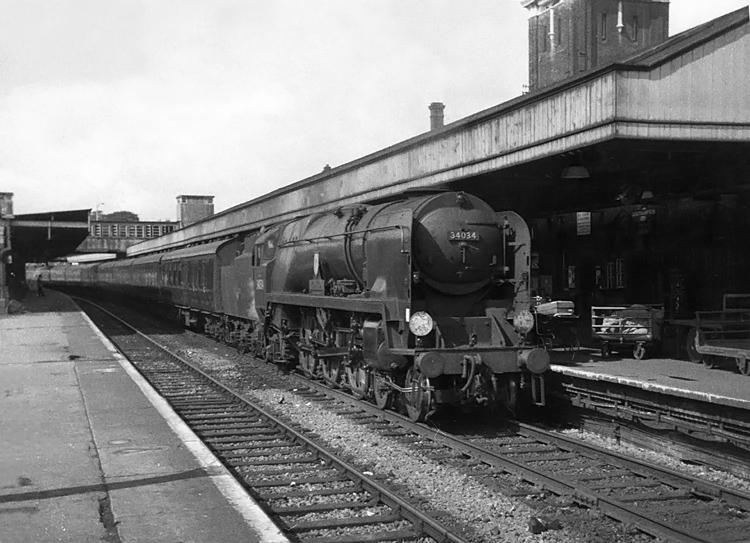 Photo of Bulleid West Country Class pacific number 34034, Honiton, drifts into Southampton Central station with what is most likely an interegional train via Basingstoke and Oxford in the mid 1960s