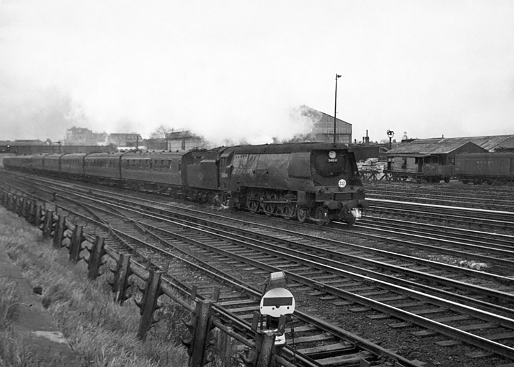 Photo of original Bulleid West Country Class pacific number 34041, Wilton, just after passing through Wimbledon station with a London, Waterloo, to the West of England train in the mid 1960s