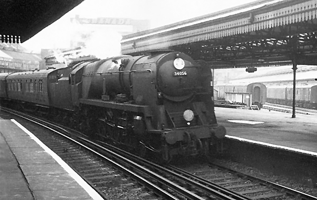 Photo of Bulleid Battle of Britain Class pacific number 34056, Croydon, heading around the 40 mph limit curves at Clapham Junction with an up West of England line train to London, Waterloo in the mid 1960s