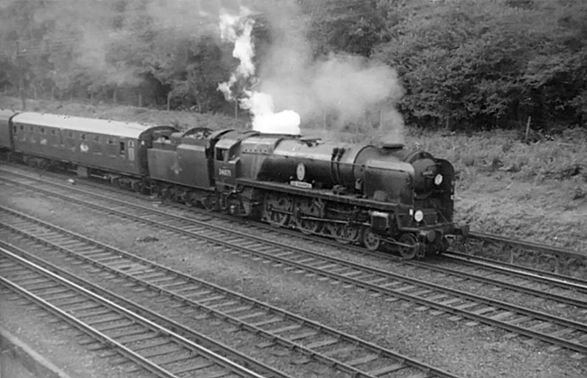 Photo of Bulleid Battle of Britain Class pacific number 34071, 601 Squadron, heading an up Bournemouth to London, Waterloo train along the slow line between Milepost 31 and Pirbight Junction in the mid 1960s