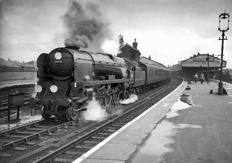 Photo of Bulleid West Sountry Class pacific number 34101, Hartland, leaving Salisbury with a Brighton to Plymouth train in the mid 1960s