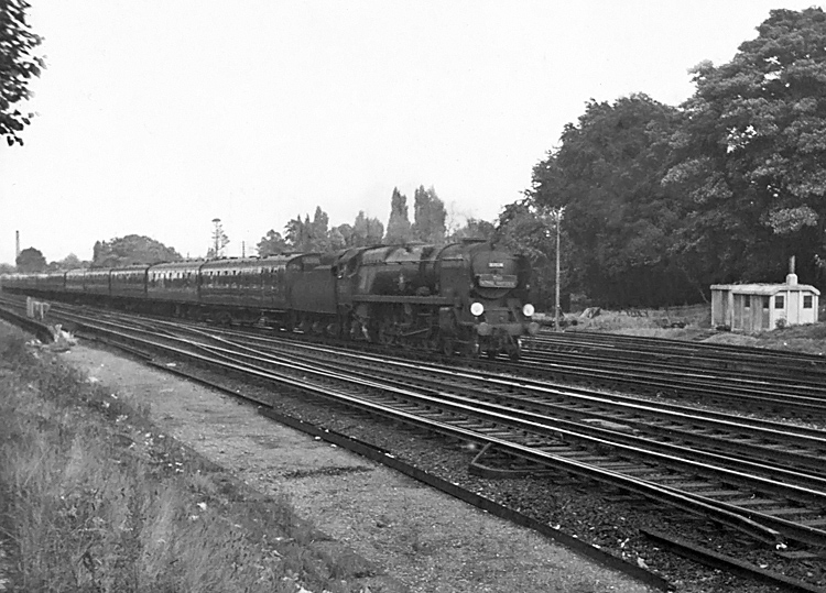 Photo of Bulleid Merchant Navy  Class pacific number 35014, Nederland Line, approaching Woking on the 16.35 London, Waterloo to Weymouth train, the down Royal Wessex in the mid 1960s