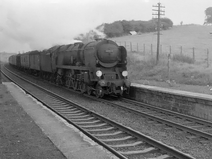 Photo of Bulleid Merchant Navy  Class pacific number 35021, New Zealand Line, heading down from Bincombe Tunnel and past the site of the closed Monkton and Came Halt to Dorchester South with the Weymouth to Bournemouth portion of a Weymouth to London, Waterloo train in the mid1960s