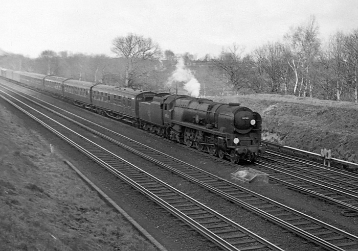 Photo of Bulleid Merchant Navy  Class pacific number 35021, New Zealand Line, heading a London, Waterloo to Bournemouth train  between Pirbight Junction and Milepost 31 in the mid 1960s