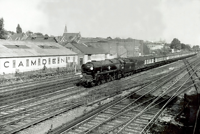 Photo of Bulleid Merchant Navy  Class pacific number 35021, Holland Amerika Line, just after passing Wimbledon  with the 12.30 Waterloo to Bournemouth West, the down Bournemouth Belle pullman car train in the mid 1960s