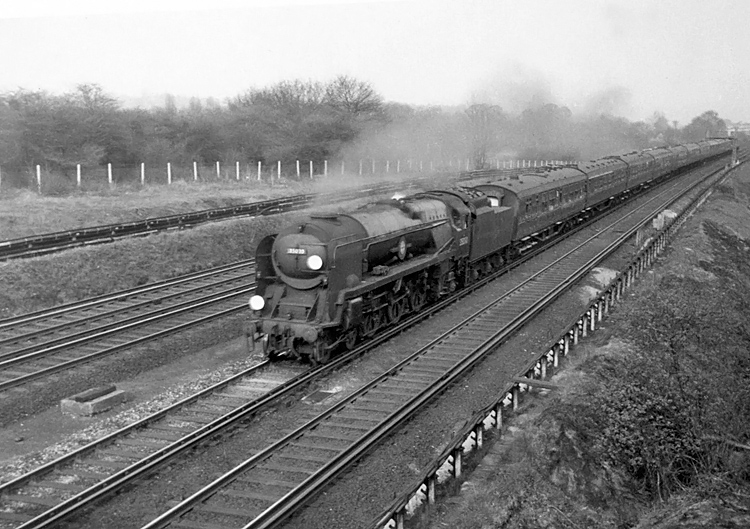 Photo of Bulleid Merchant Navy  Class pacific number 35030, Elder Dempster Lines between Raynes Park and New Malden at the head of a London, Waterloo to Bournemouth train in the mid 1960s