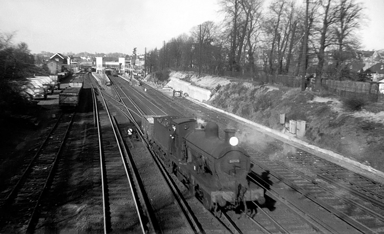 Photo of C Class 0-6-0 loco 31715 shunting across the main running lines at Bromley South in 1961
