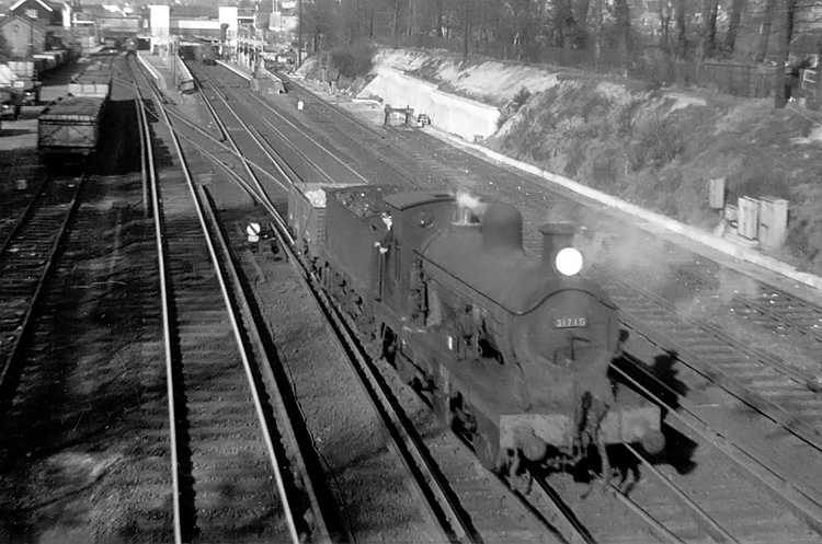 Photo of C Class 0-6-0 loco 31715 shunting across the main running lines at Bromley South in 1961