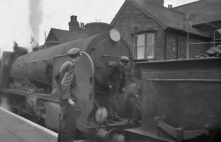 Photo of Schools Class 4-4-0 30934 with the tender of O1 Class 0-6-0 31065 just visible coupled to the front of the 4-4-0. Tonbridge on June 10th 1961