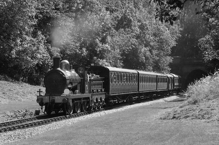 Photo of O1 Class 0-6-0 31065 exiting Sharpthorne Tunnel and passing the former West Hoathly station on the 14.00 ex Sheffield Park on 10th August 2007