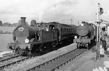 Photo of H class 0-4-4 tank loco number 31518 and D1 class 4-4-0 number 31739 on Westerham Branch line trains at Dunton Green on 28th October 1961, the last day of operation of the branch line to Westerham