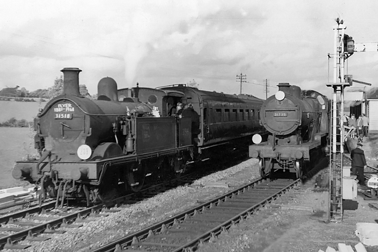 Photo of H class 0-4-4 tank loco number 31518 and D1 class 4-4-0 number 31739 on Westerham Branch line trains at Dunton Green on 28th October 1961, the last day of operation of the branch line to Westerham