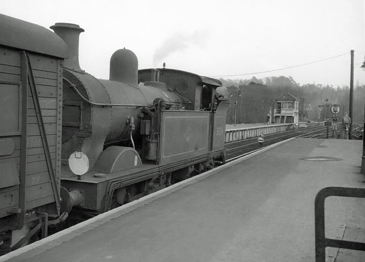 Photo of H class 0-4-4 tank loco number 31324 after running round the stock of the train it had recently hauled in from Tunbridge Wells West, circa April 1962