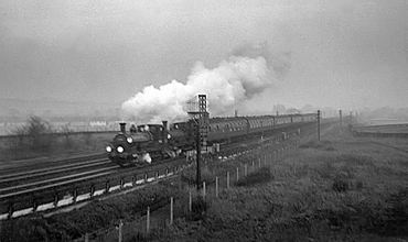 Photo of 0298 Class 2-4-0  well tank locos 30585 and 30587 near Raynes Park in December 1962