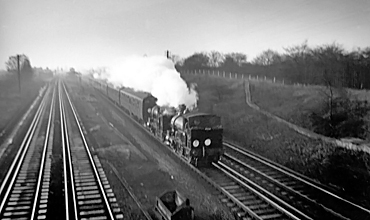 Photo of 0298 Class 2-4-0  well tank locos 30585 and 30587 heading through New Malden towards Wimbledon in December 1962 