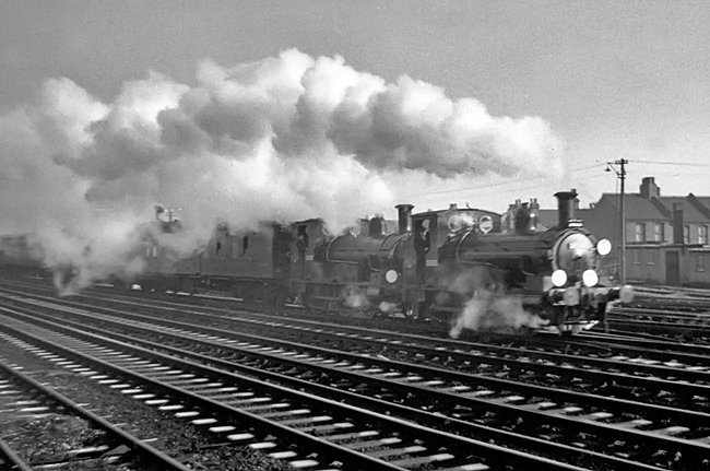 Photo of 0298 Class 2-4-0  well tank locos 30585 and 30587 in December 1962