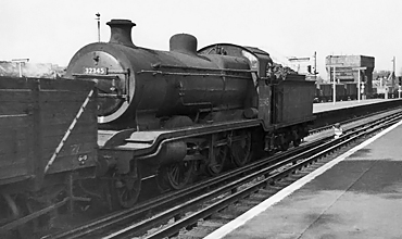 Photo of K Class 2-6-0 loco 32545 heading a goods train through East Croydon in  1961/1962