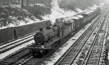 Photo of a K Class 2-6-0 loco heading into East Croydon with a goods train in winter 1961/62