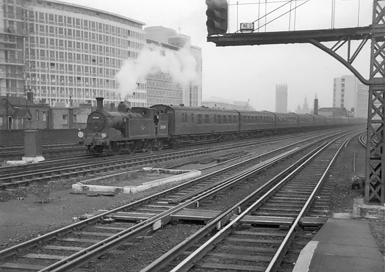 Photo of M7 Class 0-4-4 tank loco on an empty stock working from Waterloo, approaching Vauxhall. 1962