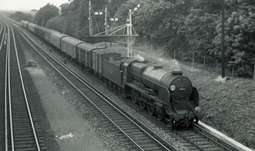 1962 photo of Lord Nelson Class 30850 on up parcels train near Weybridge