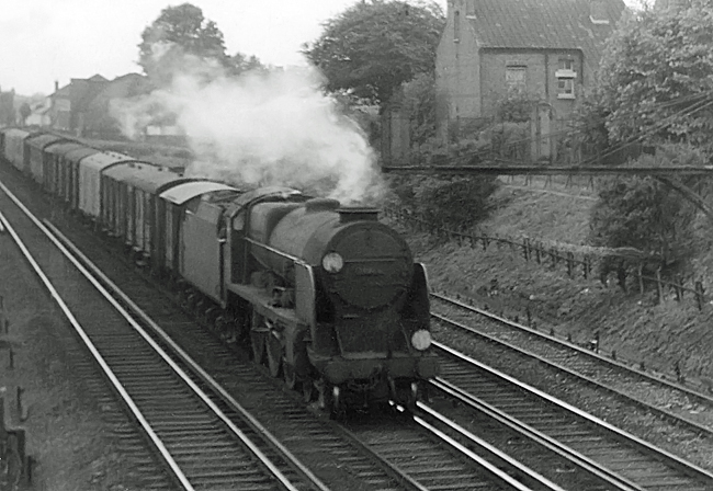 A 1962 photo of Lord Nelson Class 30856 on an up parcels train  passing New Malden