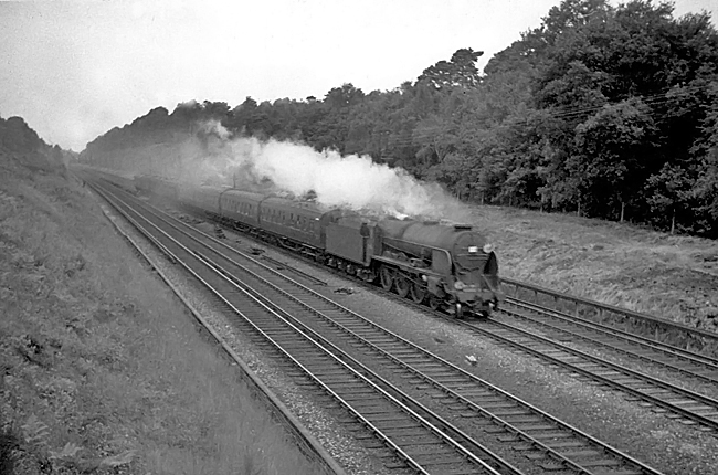 A 1962 photo of Lord Nelson Class 30857 on an up Bournemouth to Waterloo express train between Milepost 31 and Pirbight Junction
