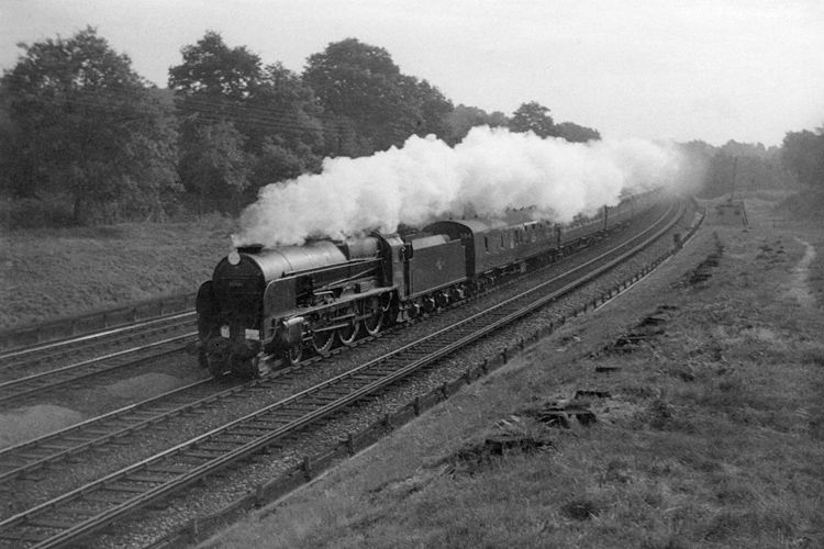 September 1962 photo of Lord Nelson Class 30861 on railtour between Pirbight Junction and Milepost 31