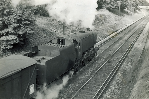 Photo of  Q1 Class 0-6-0 33013 climbing out of Redhill towards Guildford on a goods train. Spring 1962
