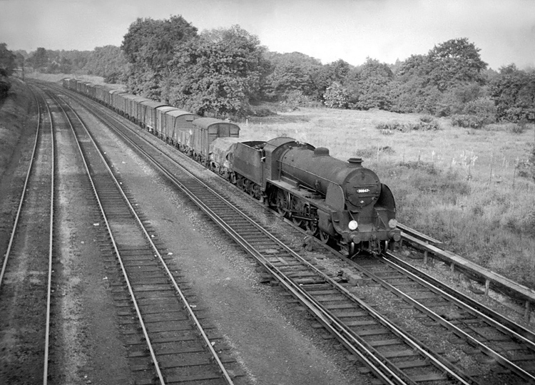 Photo of Maunsell S15 class 4-6-0 number 30847 on an up freight approaching Woking Junction on the line from Guildford on 1st June 1963