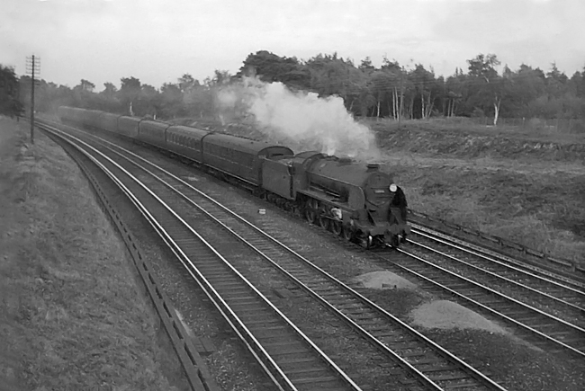 Photo of Maunsell S15 class 4-6-0 number 30846 on a down Basinsgtoke local train heading along between Pirbight Junction and Milepost 31 in August 1962