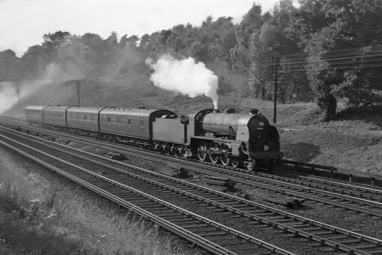 Photo of Maunsell S15 class 4-6-0 number 30844 on an up local train from Salisbury to Waterloo, due 17.36,  between Milepost 31 and Pirbight Junction on 25th August 1962