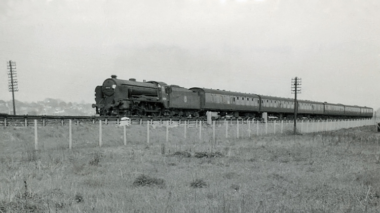 Photo of Schools Class 4-4-0 30912 just West of Raynes Park on a Basingstoke Local train  on 23rd April 1962