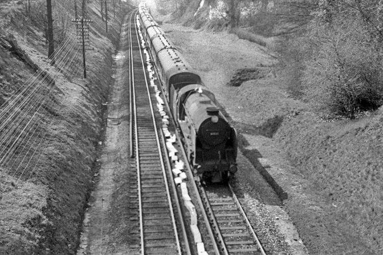 Photo of Schools Class 4-4-0 30901 drifting down into Redhill with the 14 coach, 07.40 Birkenhead to Margate train at circa 15.03 on 25th April 1962