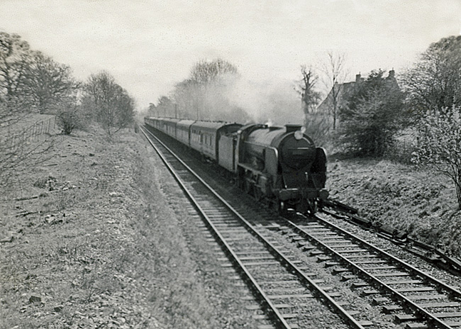 Photo of a Schools Class 4-4-0 30911 between Reigate and Betchworth with the 09.25 Margate to Birkenhead train on 25th April 1962