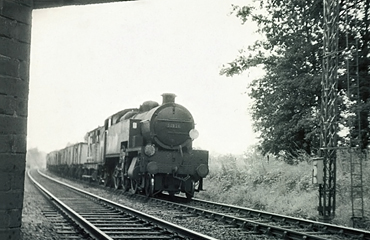Photo of W Class 2-6-4 tank loco 31921 stopped at a signal South of Hurst Green Junction, on a goods train on the line from Brighton via Lewes and Uckfield. Spring 1962