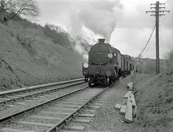 Photo of W Class 2-6-4 tank loco 31918 on a goods train somewhere on the Oxted line system in 1962