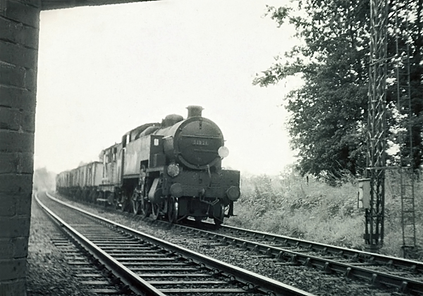 Photo of W Class 2-6-4 tank loco 31921 stopped at a signal South of Hurst Green Junction, on a goods train on the line from Brighton via Lewes and Uckfield. Spring 1962